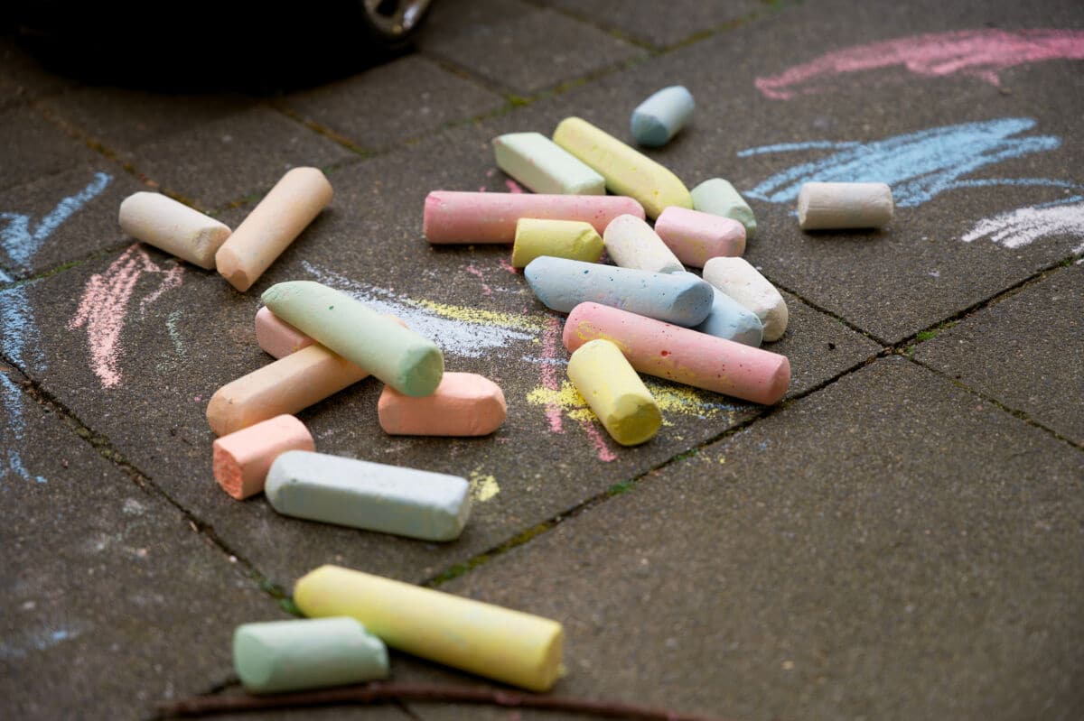 Multicolored sticks of chalk on the floor