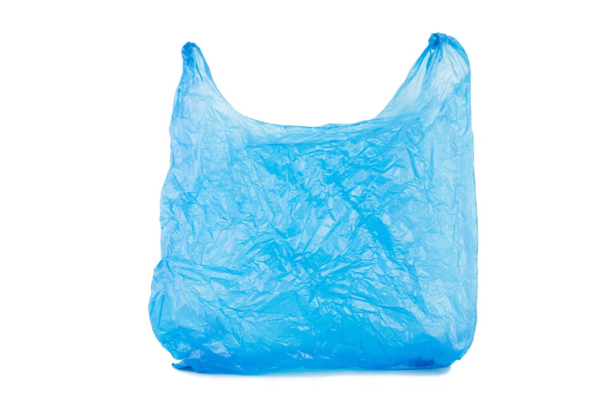 A blue plastic carrier bag isolated on white